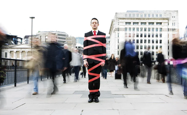 businessman in red tape