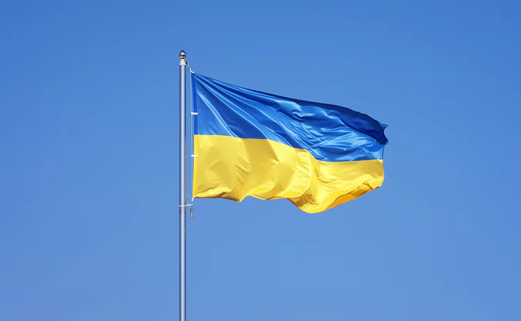 Ukraine flag against blue sky