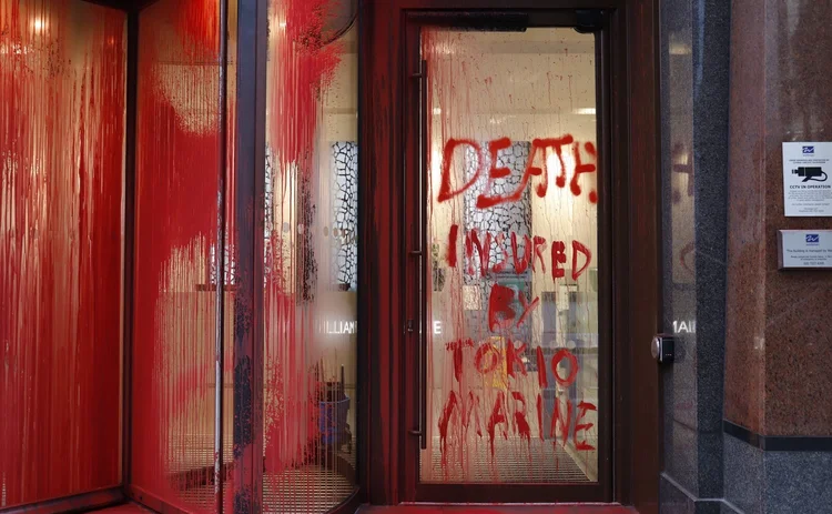 Windows smashed and insurance offices defaced by Shut The System activists