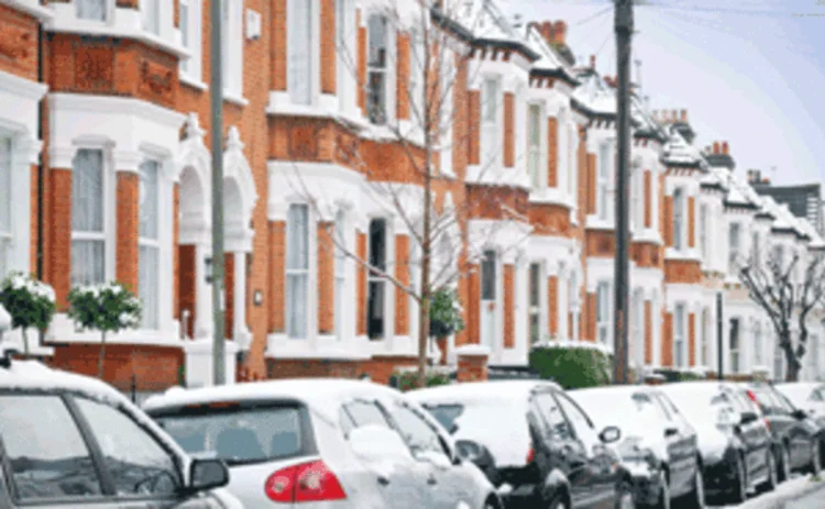 Row of houses and parked cars