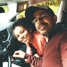 Father and daughter enjoying the car trip